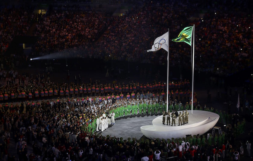 The Olympic flag is risen during the opening ceremony [Photo: Reuters/Mike Blake]