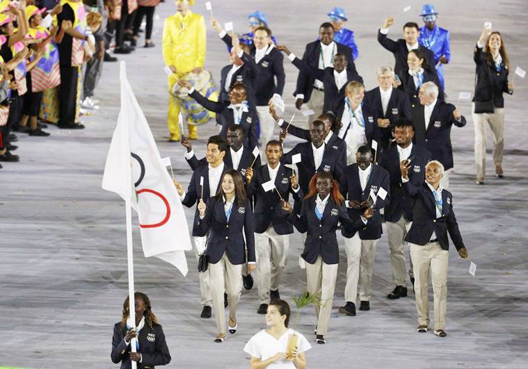 Flagbearer Rose Nathike Lokonyen of the Refugee Olympic Athletes leads her contingent during the opening ceremony. [Photo: Reuters/Stoyan Nenov]