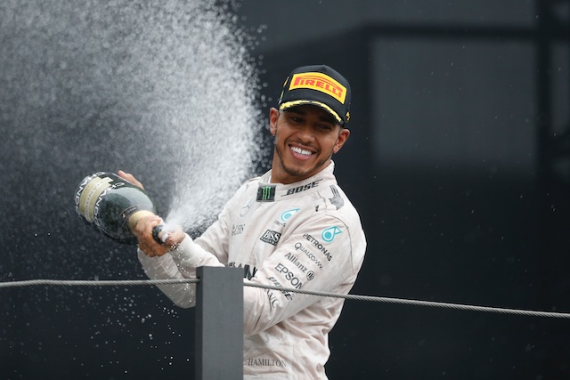 Lewis Hamilton celebrates [AP Photo/Leo Correa]